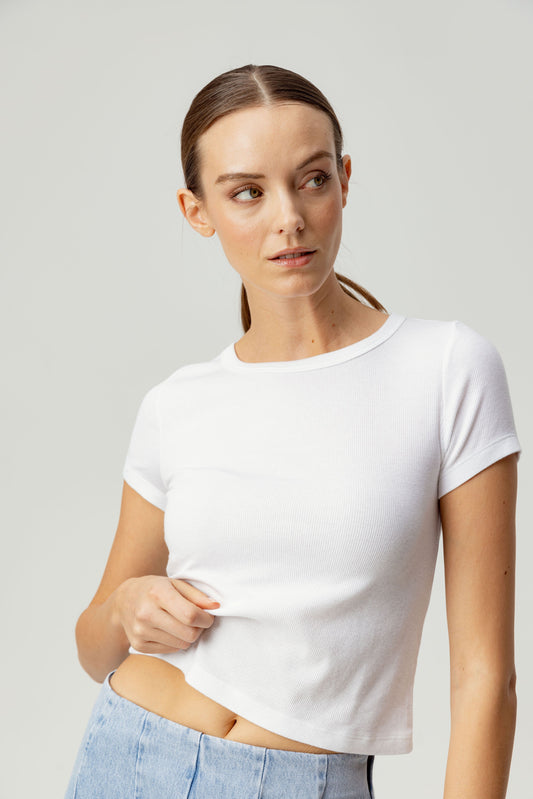 Meet the Brother tee. Fit as if you stole your little brother's t-shirt, the Brother tee has a shrunken fit through the body with a short cap sleeve. Finishing right at your belly button, the Brother tee is perfect for styling with high-waisted bottoms.&nbsp;