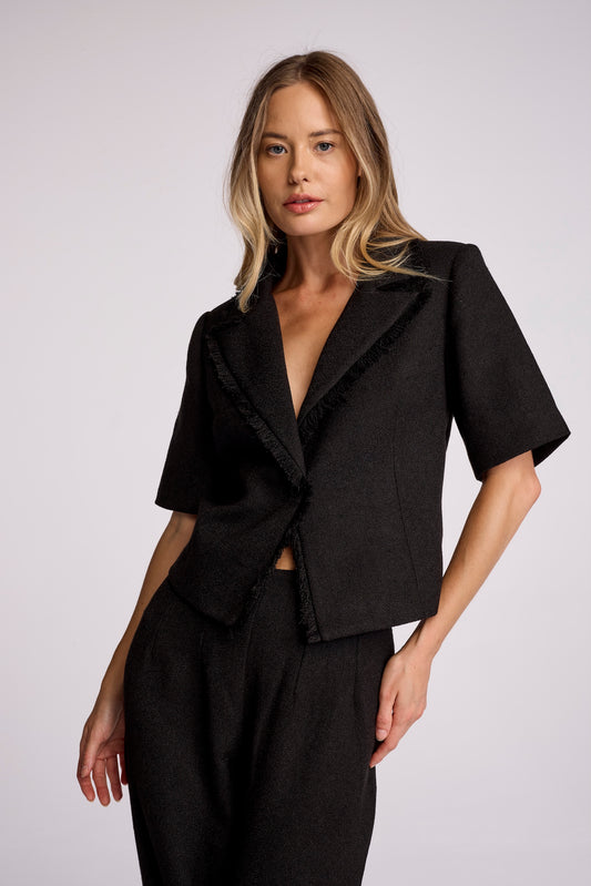 Made in a new soft-washed lux boucle, the Dylan blazer has a feminine quarter length sleeve and a slightly shrunken fit through the body. The lapel is elevated with a fringed edge finish. Fit to effortlessly accentuate your waist, it is the perfect casual-tailored essential.