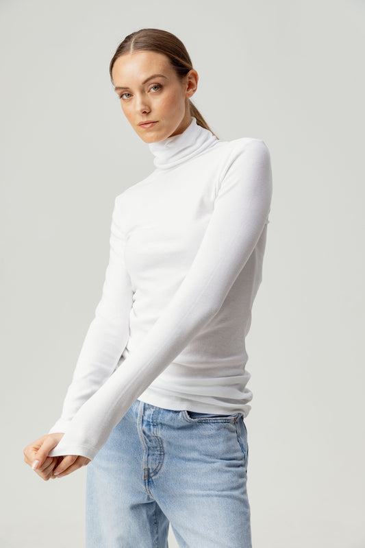 Say hello to the Katya turtleneck, the ultimate layering tee for any season. Stay warm and chic with its extended turtle neck, slim fit body, and sleeve design. Perfect for effortless and stylish layering. Made from our signature butter-soft rib fabric with excelent recovery. Hand-washed and pre-shrunk in LA.