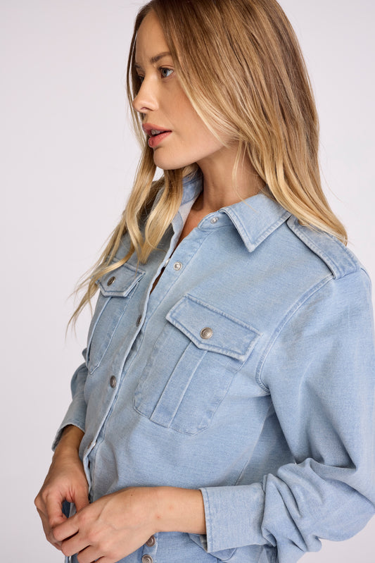 The shirt your closet is missing: Rowan. Crafted from denim with a rich, elegant wash, this piece adds a touch of refinement to any wardrobe. Perfectly worn-in, it offers the ideal balance of softness and structure, making it both comfortable and elevated.