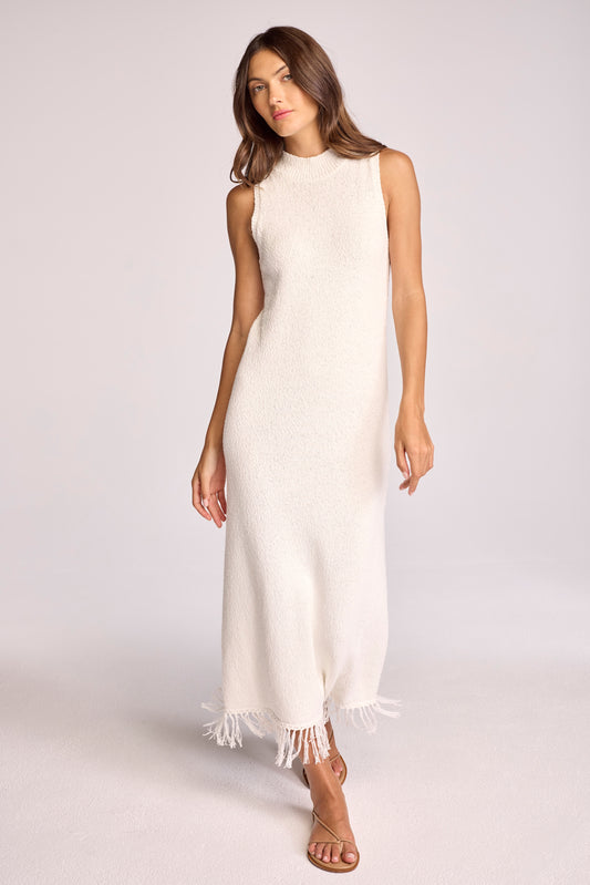 Crafted from our signature cotton boucle yarn, this midi dress is a perfect blend of texture and elegance. The delicate fringe details along the hem adds a playful yet refined touch, making it the ideal piece to transition into spring. With its soft, breathable fabric and flattering silhouette, the India Dress...