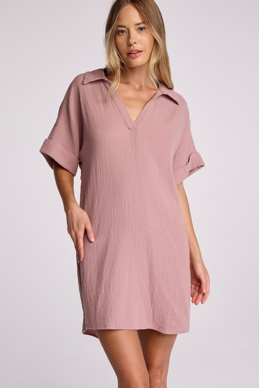 Meet Harper. Made from 100% cotton gauze, this dress embodies comfort and breathability. Featuring a collared neckline with a plunging split neck and a casual rolled sleeve, this is an update to the classic t-shirt dress with a slightly oversized and boxy fit. We recommend sizing down if you prefer more fitted styling.